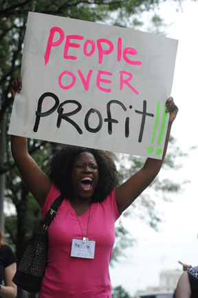 People Over Profit 2011 protest sign