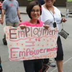 Employment = Empowerment protest sign