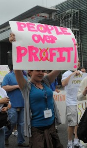 People Over Profit 2012 sign