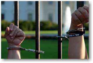 ADAPTers hands chained to White House Fence