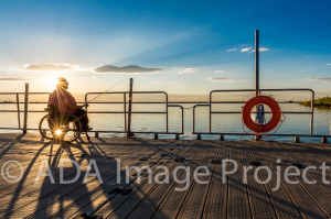 Jaime Lewis enjoying a beautiful sunrise from an accessible fishing dock