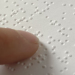 Braille Document being read with a finger